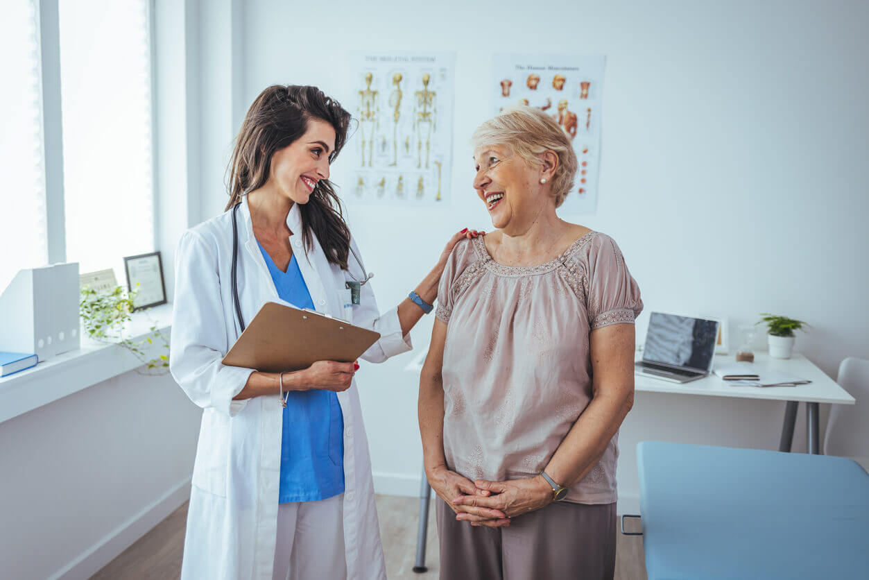 Older woman seeing her doctor who specializes in care for senior citizens.